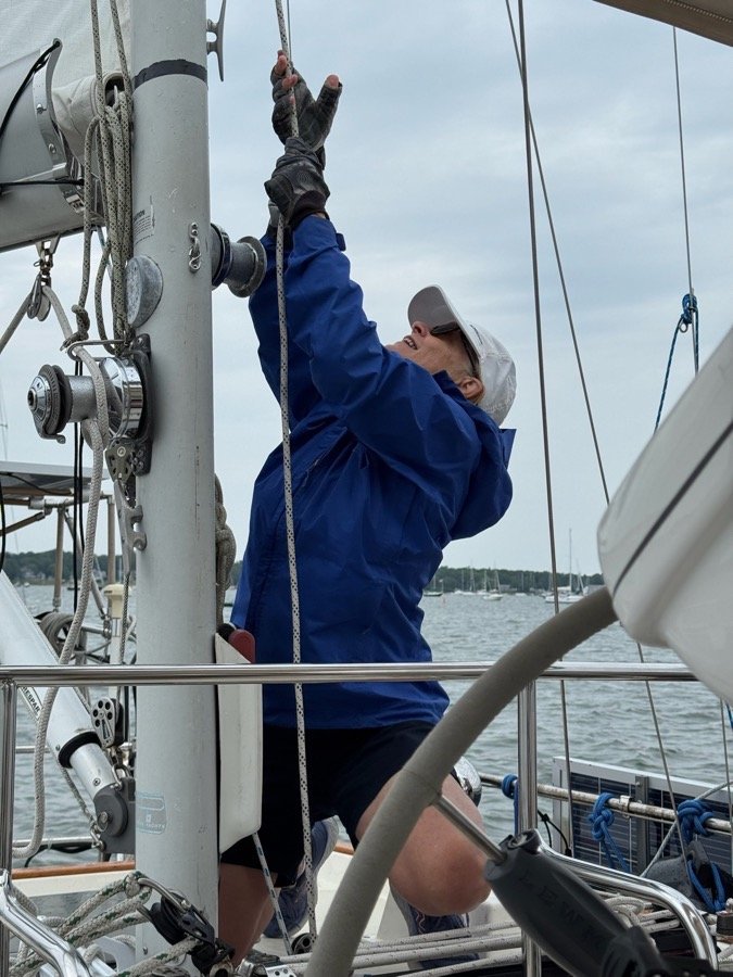 Guests taking the helm aboard Our Passion